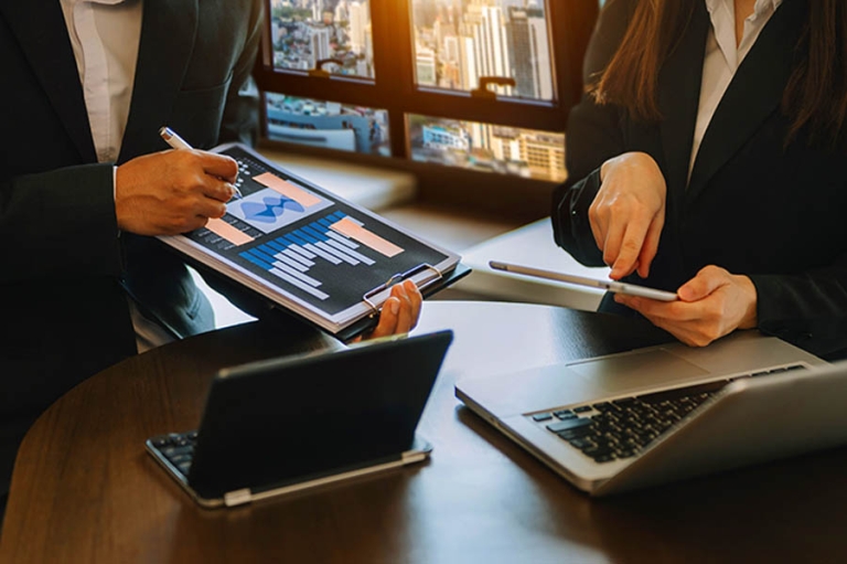 How to Fund Your Next Big Move Without Touching Your Savings; Businessman and team analyzing financial statement Finance task. with smart phone and laptop and tablet. Wealth management concept